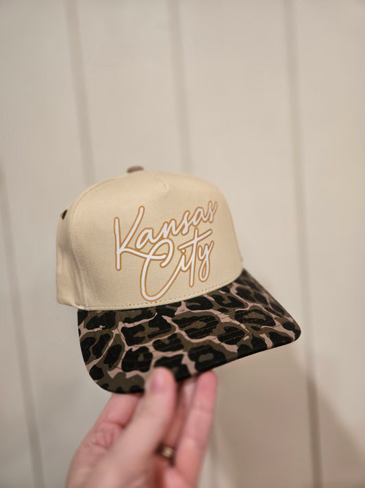 KANSAS CITY Script Leopard Trucker Hat (Beige Font)