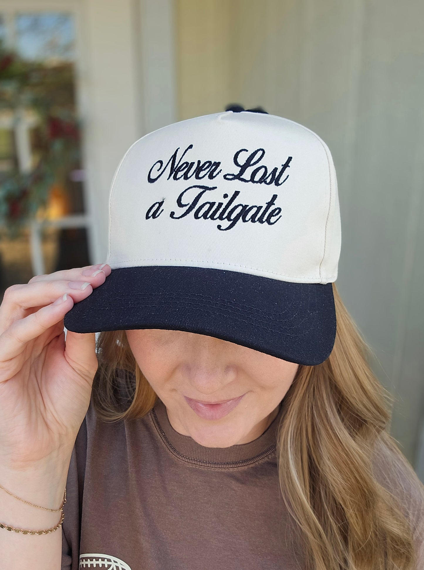 NEVER LOST A TAILGATE Embroidered Black/Beige Trucker Hat