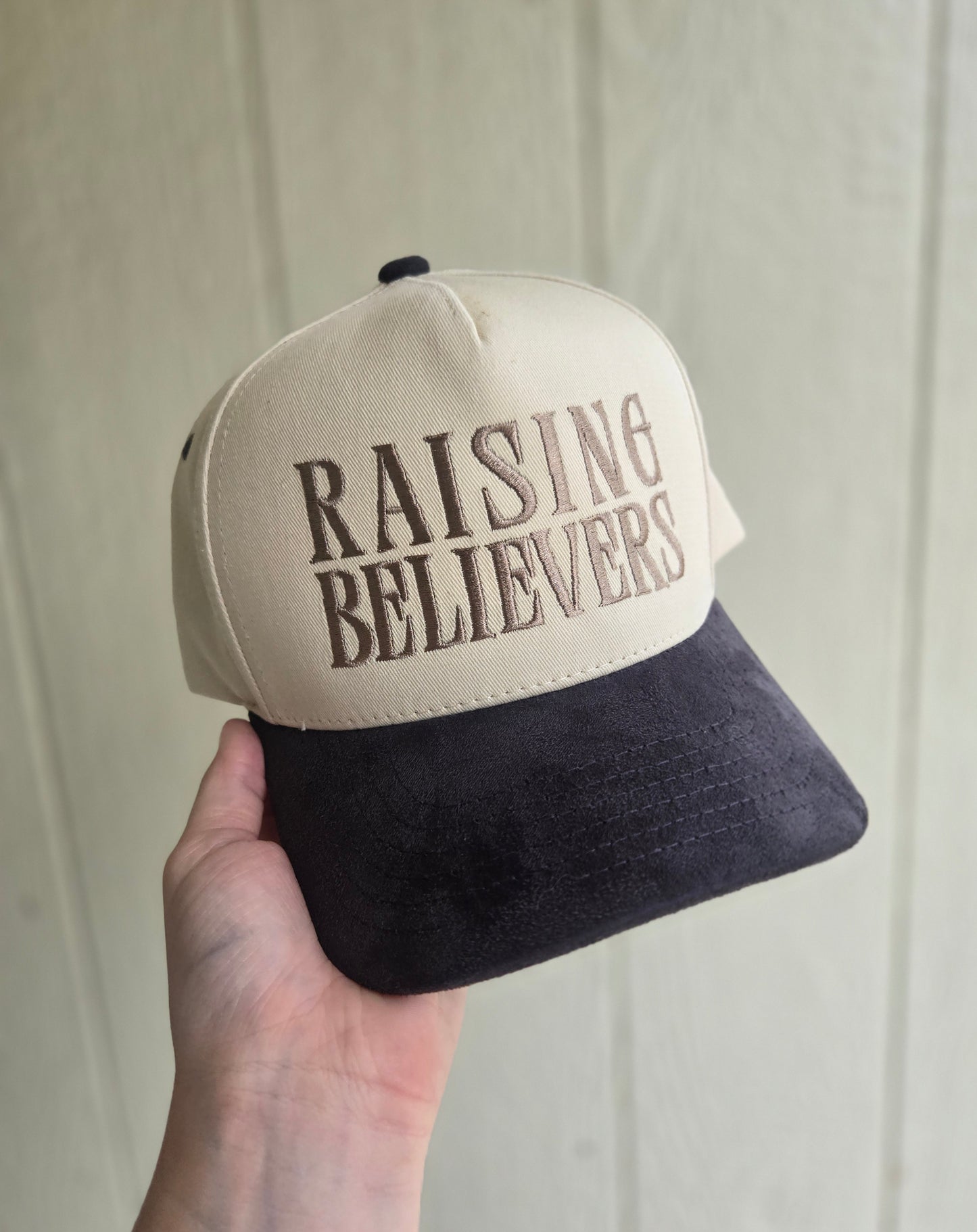 RAISING BELIEVERS Suede Two-Tone Embroidered Trucker Hat